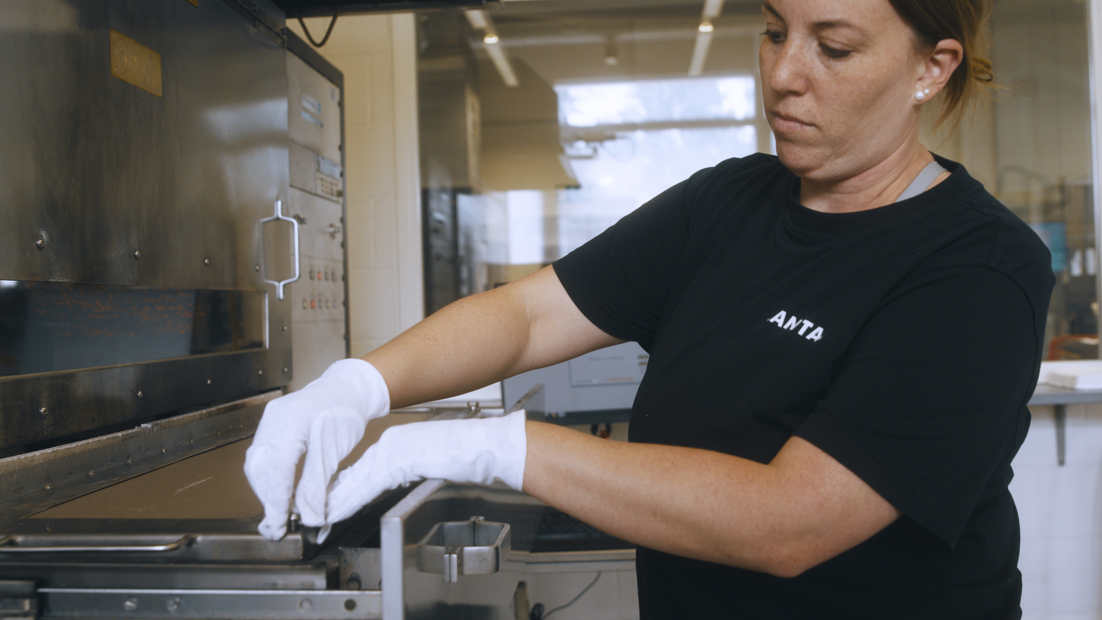 LANTAL laboratory specialist preparing a specimen for railway fire testing